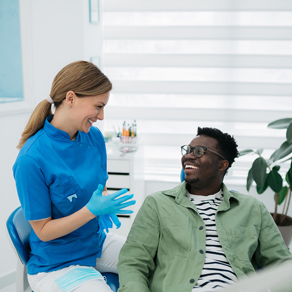 doctor checking patient's teeth